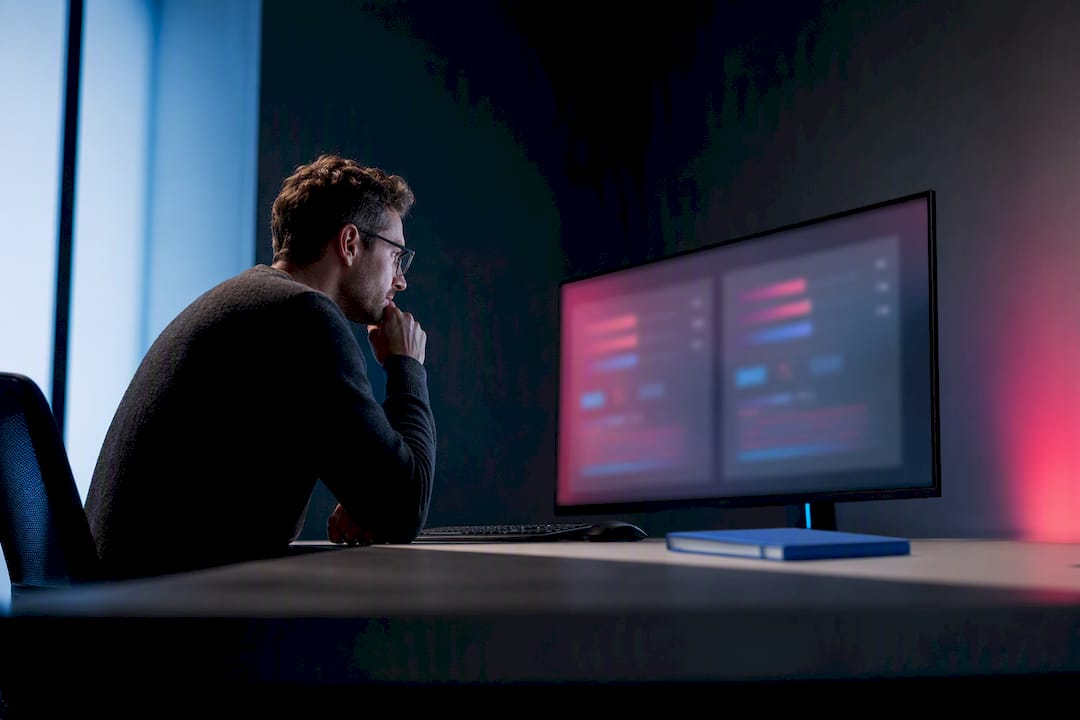 Engineer reviewing paired prompt evaluation results