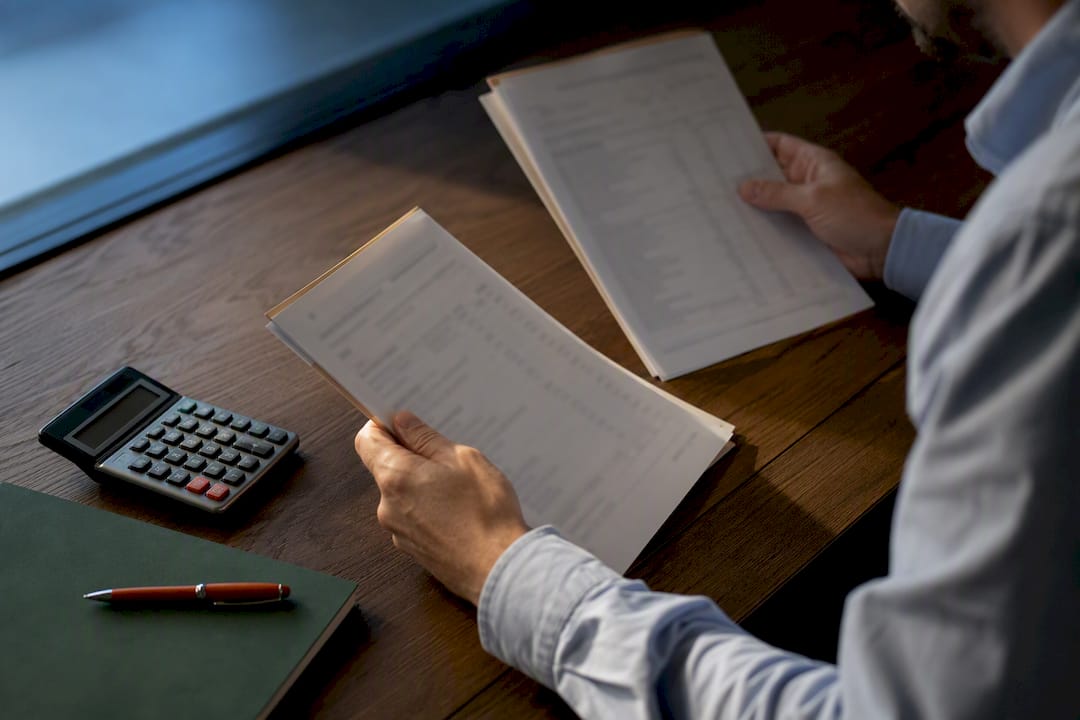 Claims reviewer comparing insurance payment records