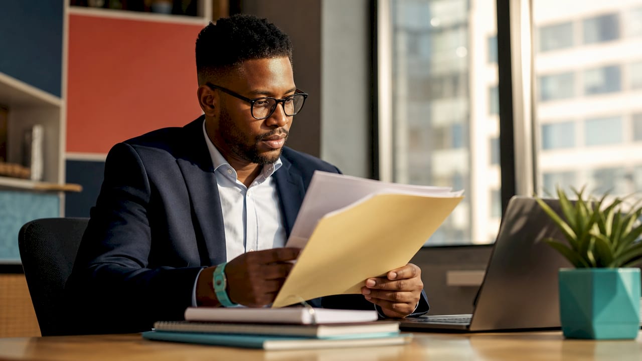 Businessman reviewing supplier documents