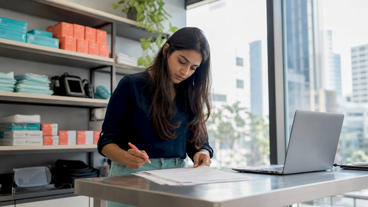 Entrepreneur reviewing medical supply drop shipping documents