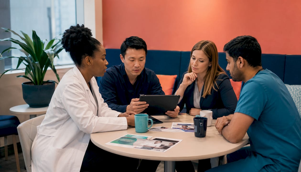 Healthcare team collaborating on procurement data