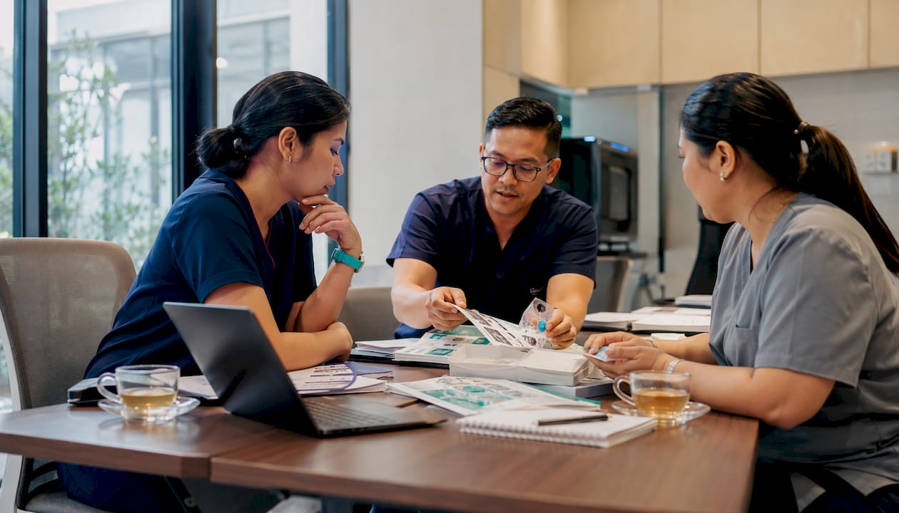 Procurement team reviewing medical supplies