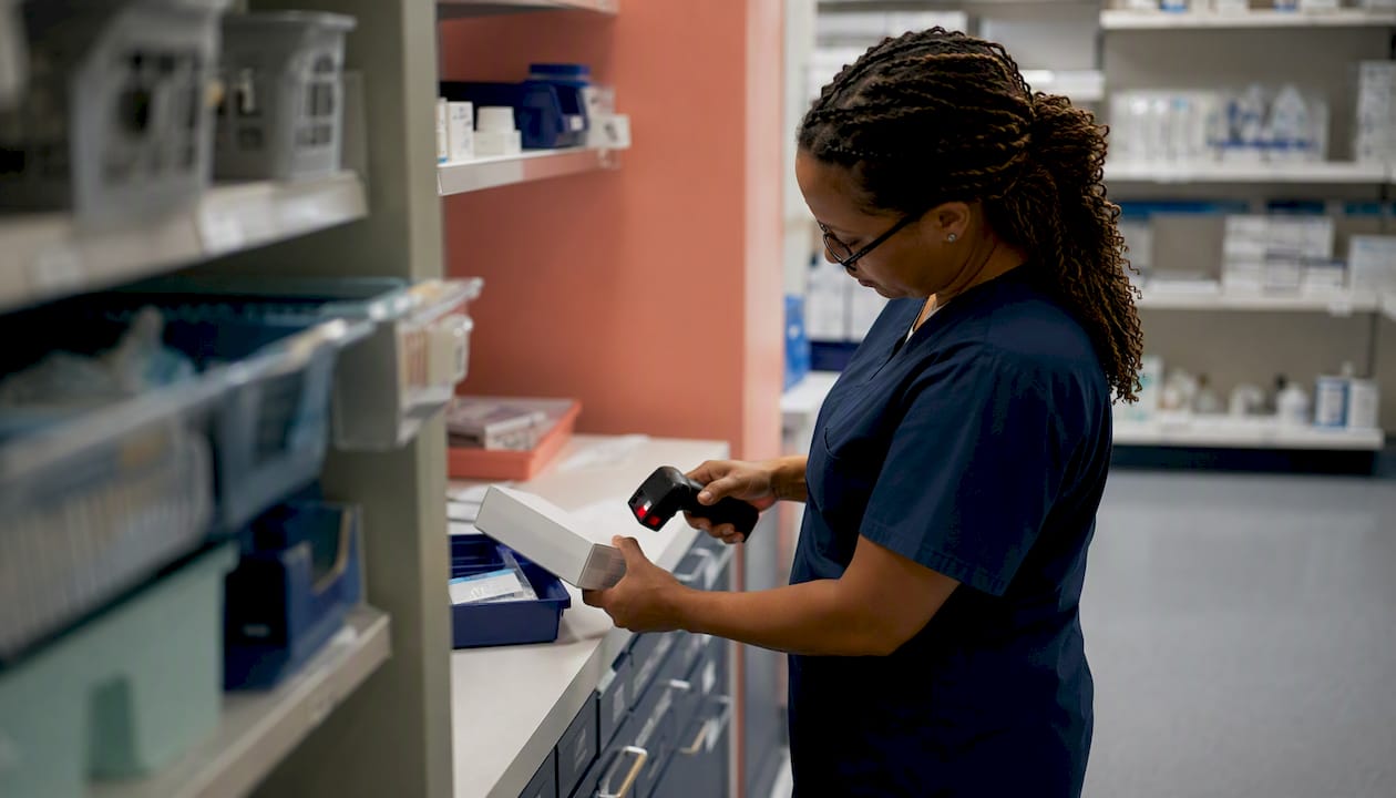 Healthcare worker scanning medical supply barcode