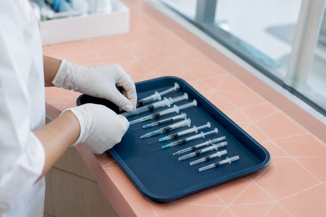 Close-up of needles and syringes in clinical setting