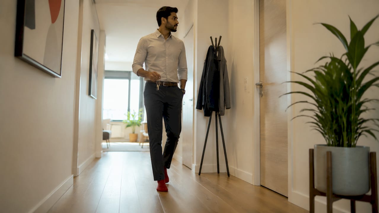 Man walking comfortably through narrow hallway