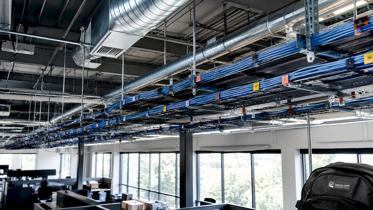 Cable trays installed at compliant spacing in open ceiling