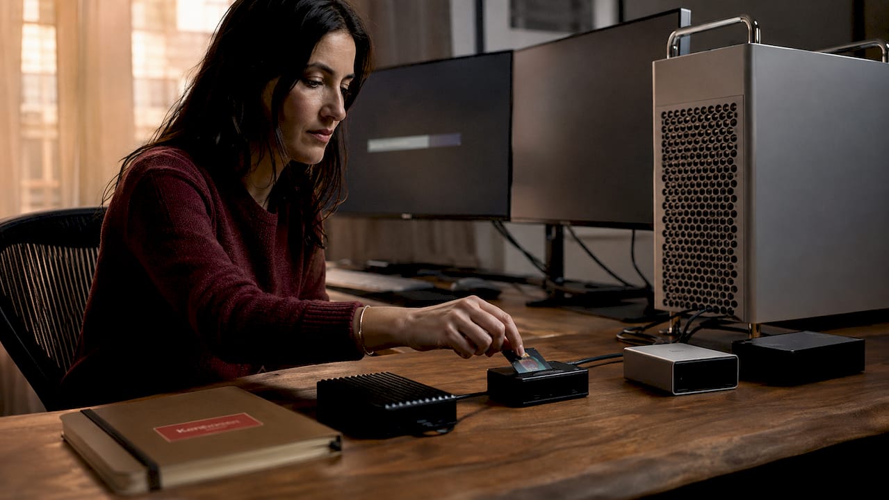 Digital tech managing RAW file transfer in studio