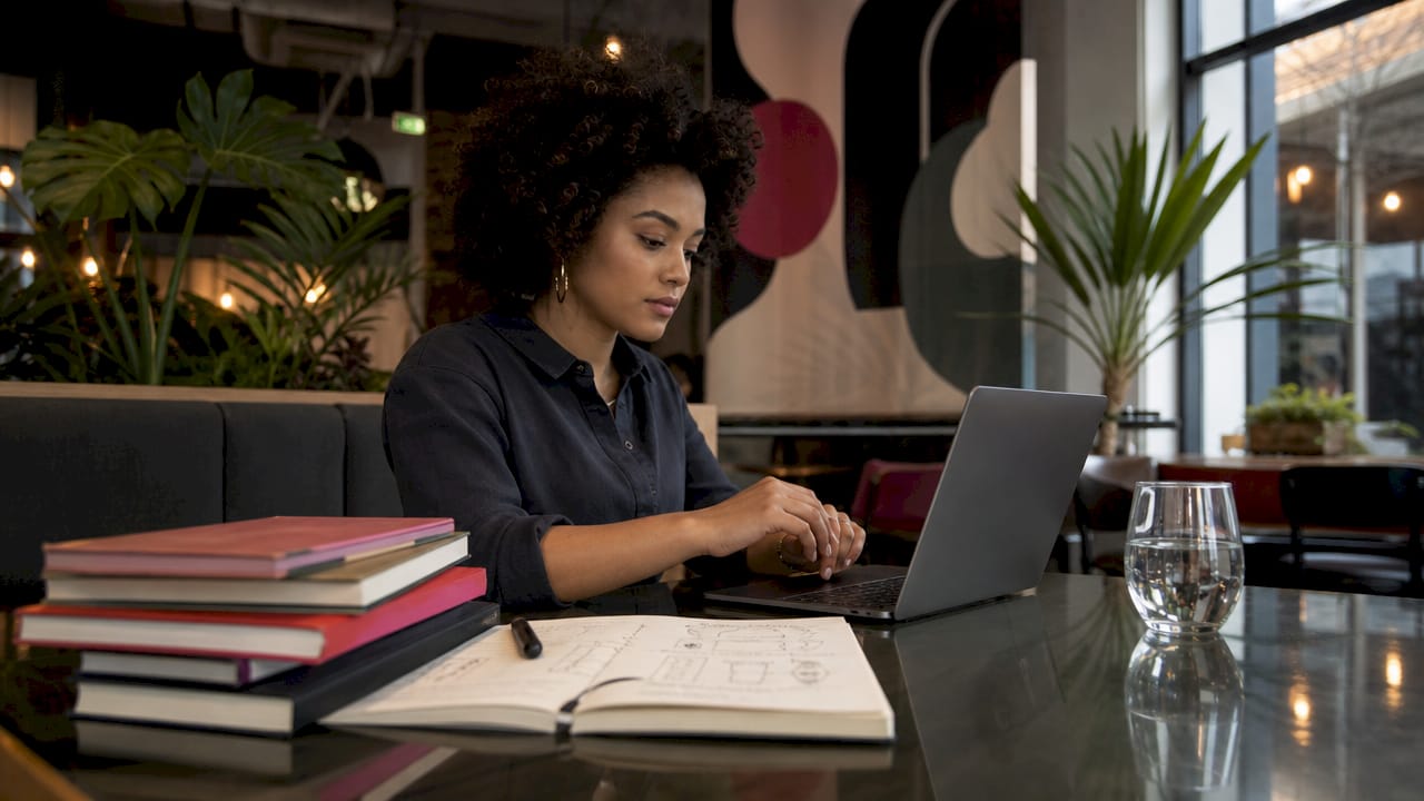 Engineer typing fintech AI software at desk