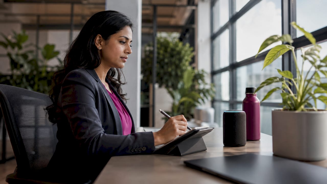 Woman using AI assistant in small office