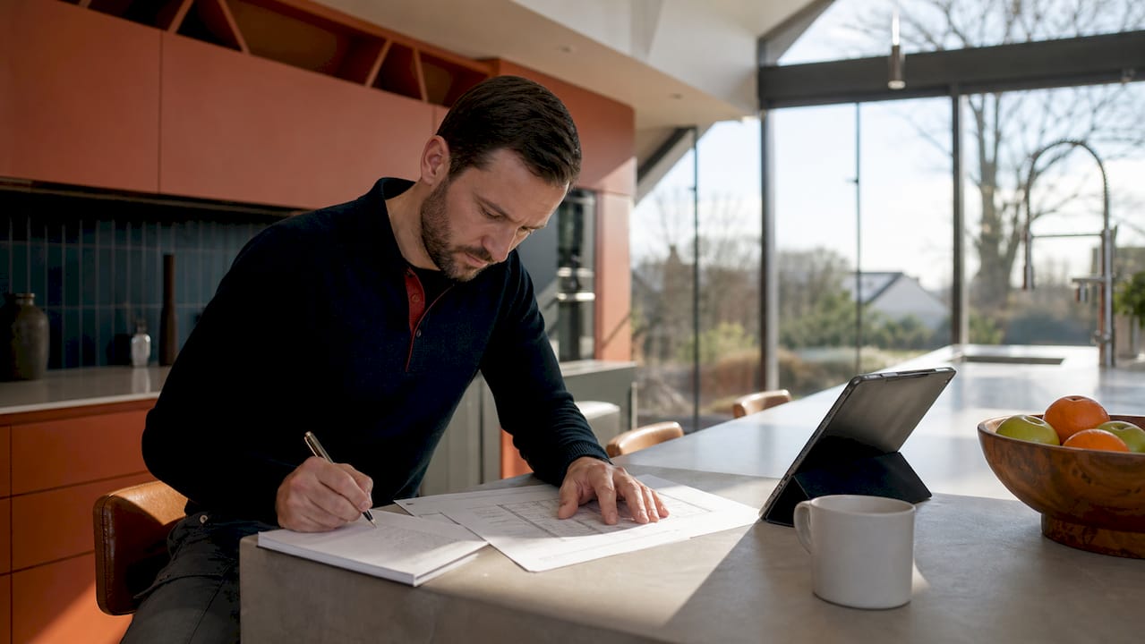 Installer reviewing solar installation regulations and plans