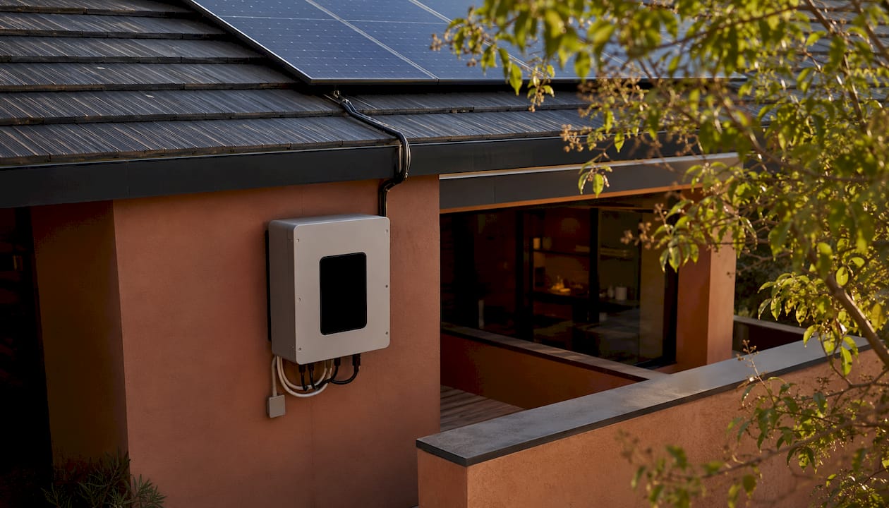 Close-up of home solar inverter mounted outdoors