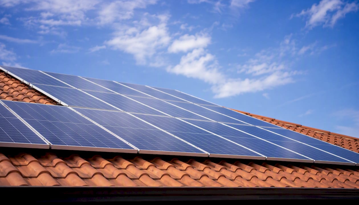 South-facing solar panels on roof in daylight