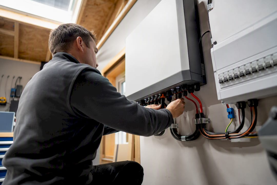 Installer wiring home battery storage unit
