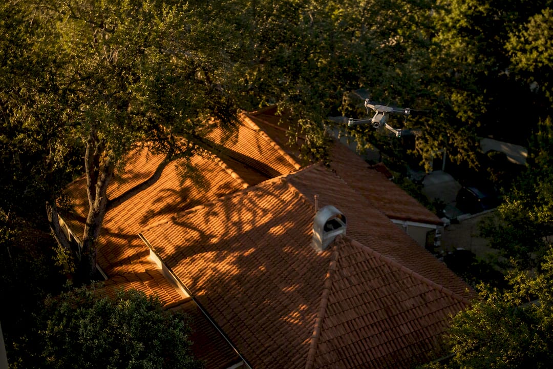 Drone capturing roof and tree shading data