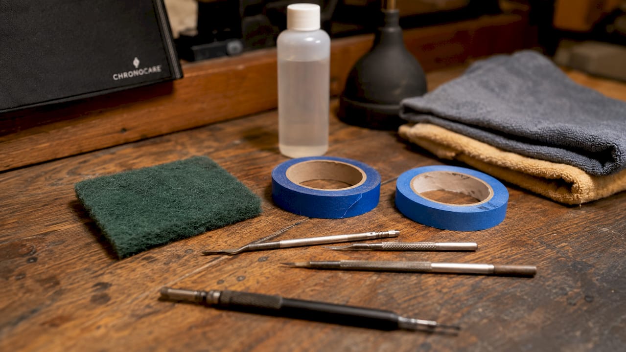 Close-up of watch refinishing tools on desk
