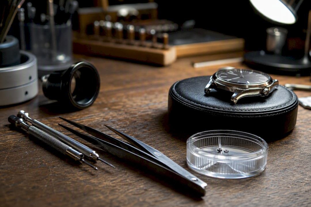 Watch restoration tools and watchholder on bench