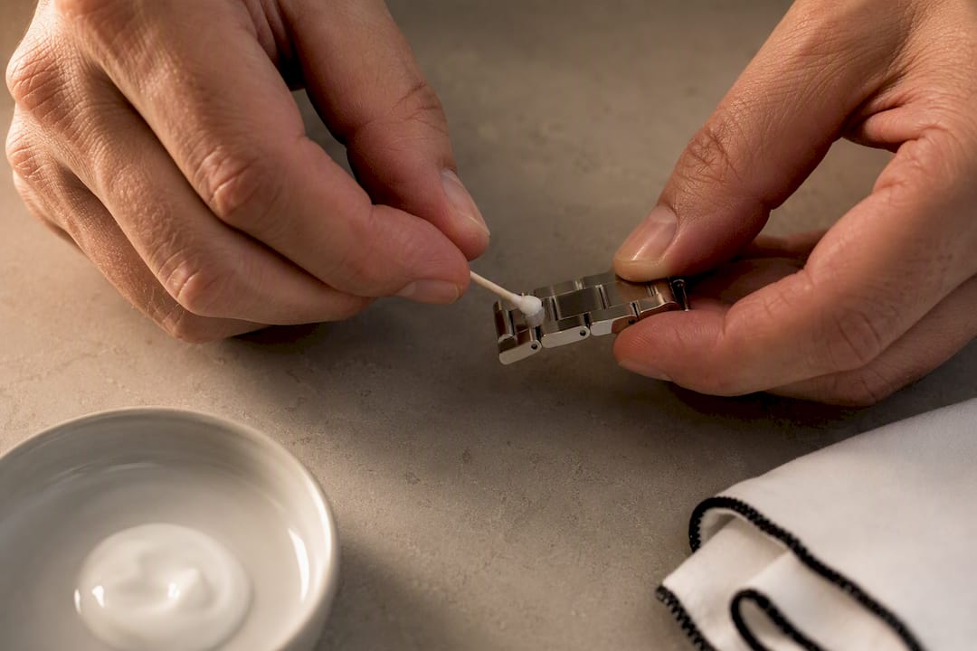 Polishing cream applied to bracelet inner link