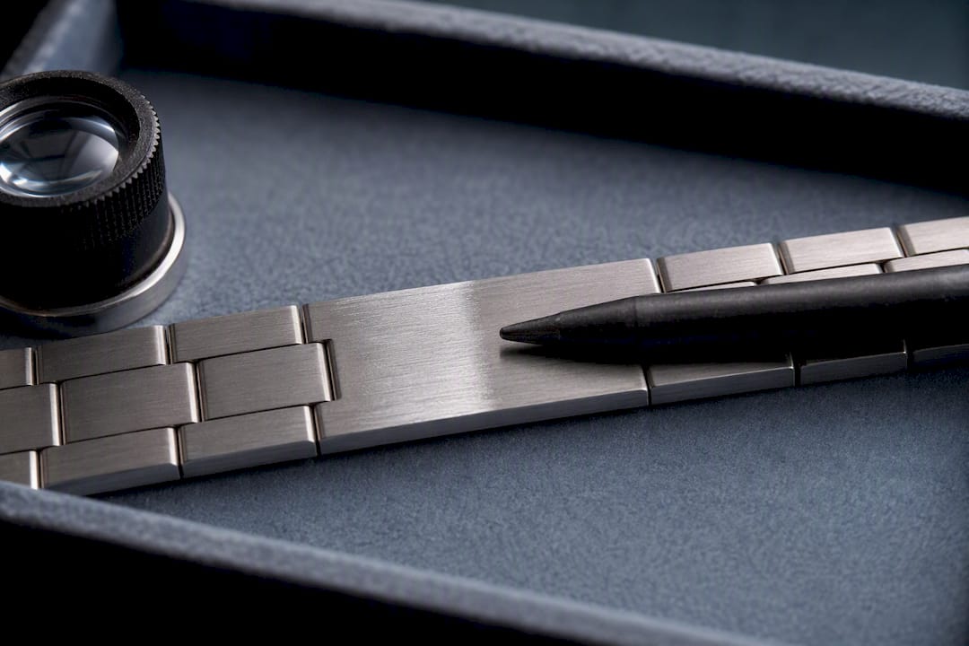 Fiberglass pen aligned with brushed bracelet grain
