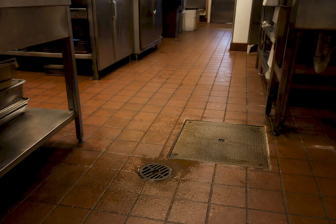 Slow draining floor drain near grease trap