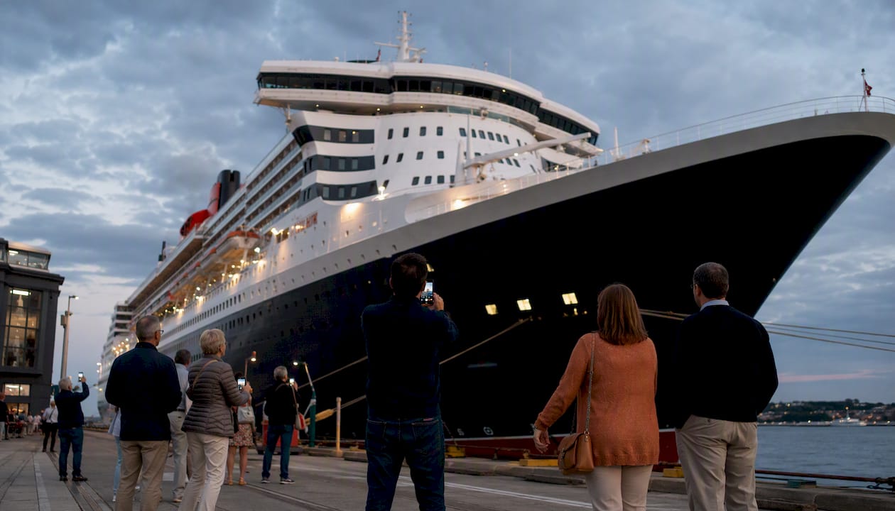 Queen Mary 2 docked at harbor in afternoon