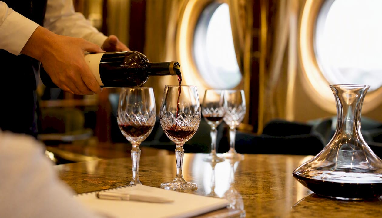 Sommelier pouring wine in certification class