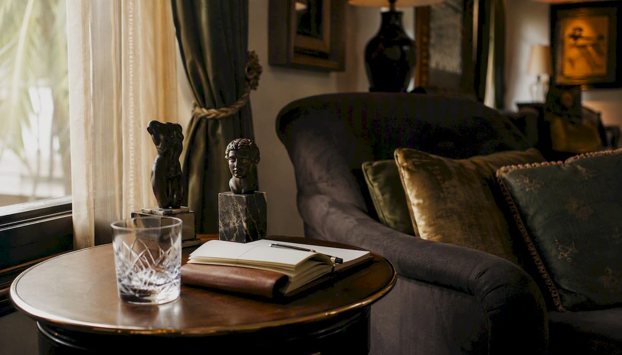 Plush luxury collectors lounge interior with table