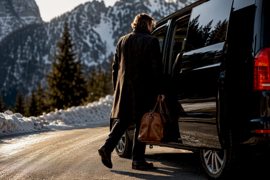 Traveler boarding shuttle on alpine event road