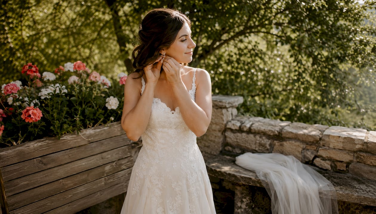 Bride preparing for bridal portrait session indoors