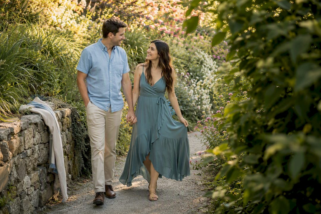 Couple walking in summer engagement outfits outdoors