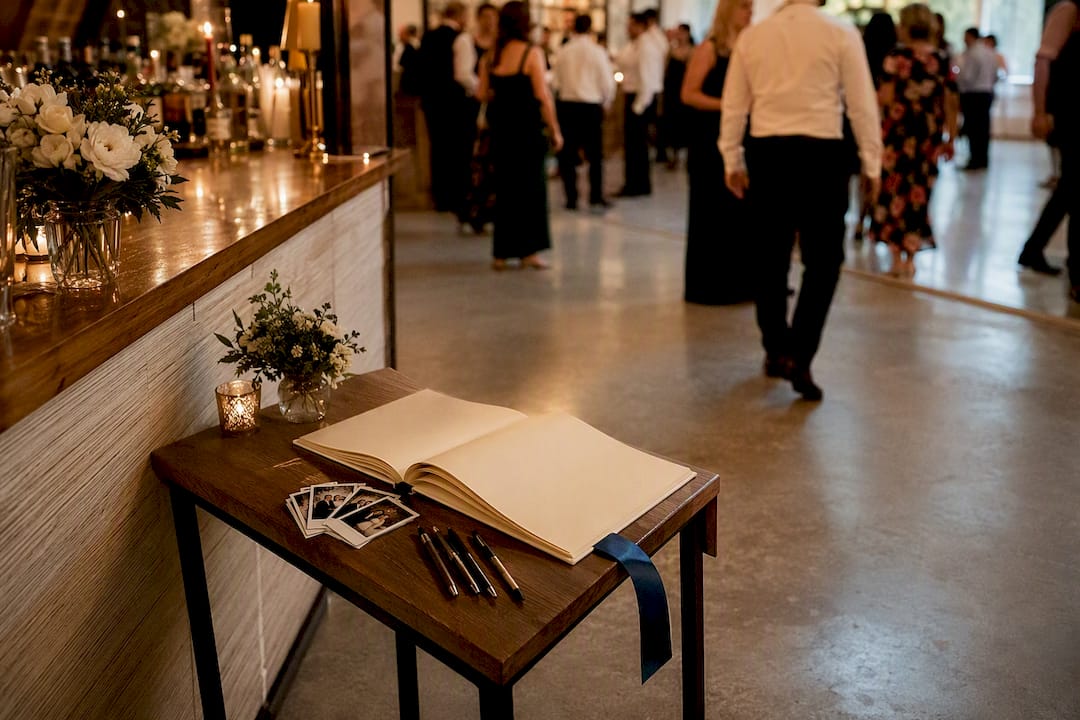 Guest book station placed beside reception bar