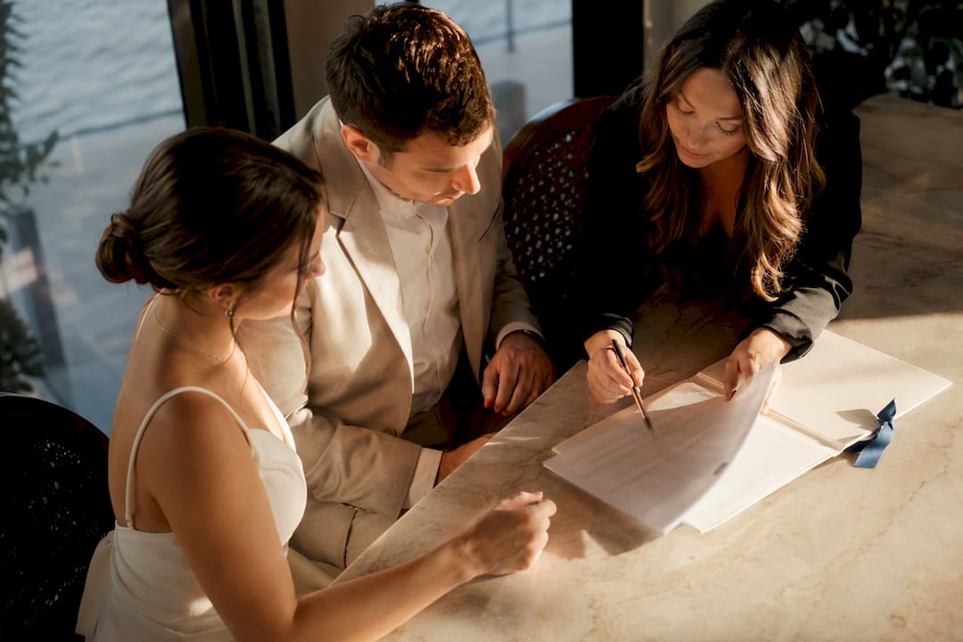 Couple reviewing wedding photography contract