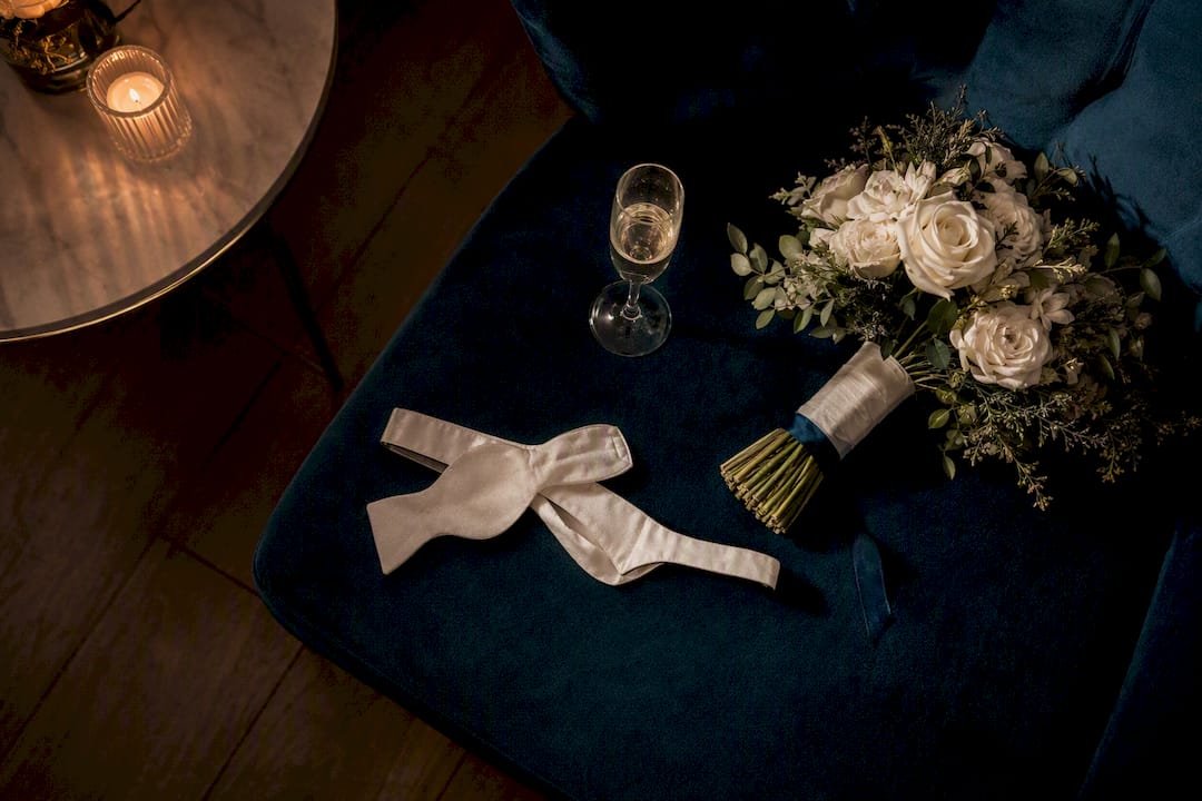 Champagne bouquet and bow tie after reception