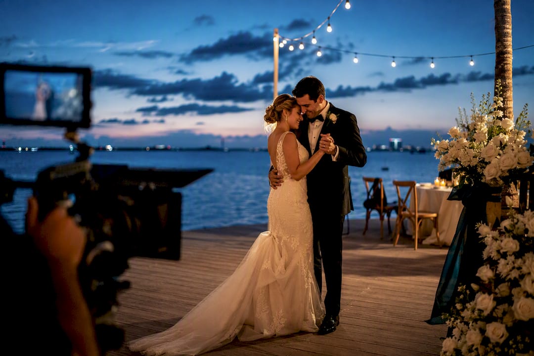 Videographer filming a wedding first dance