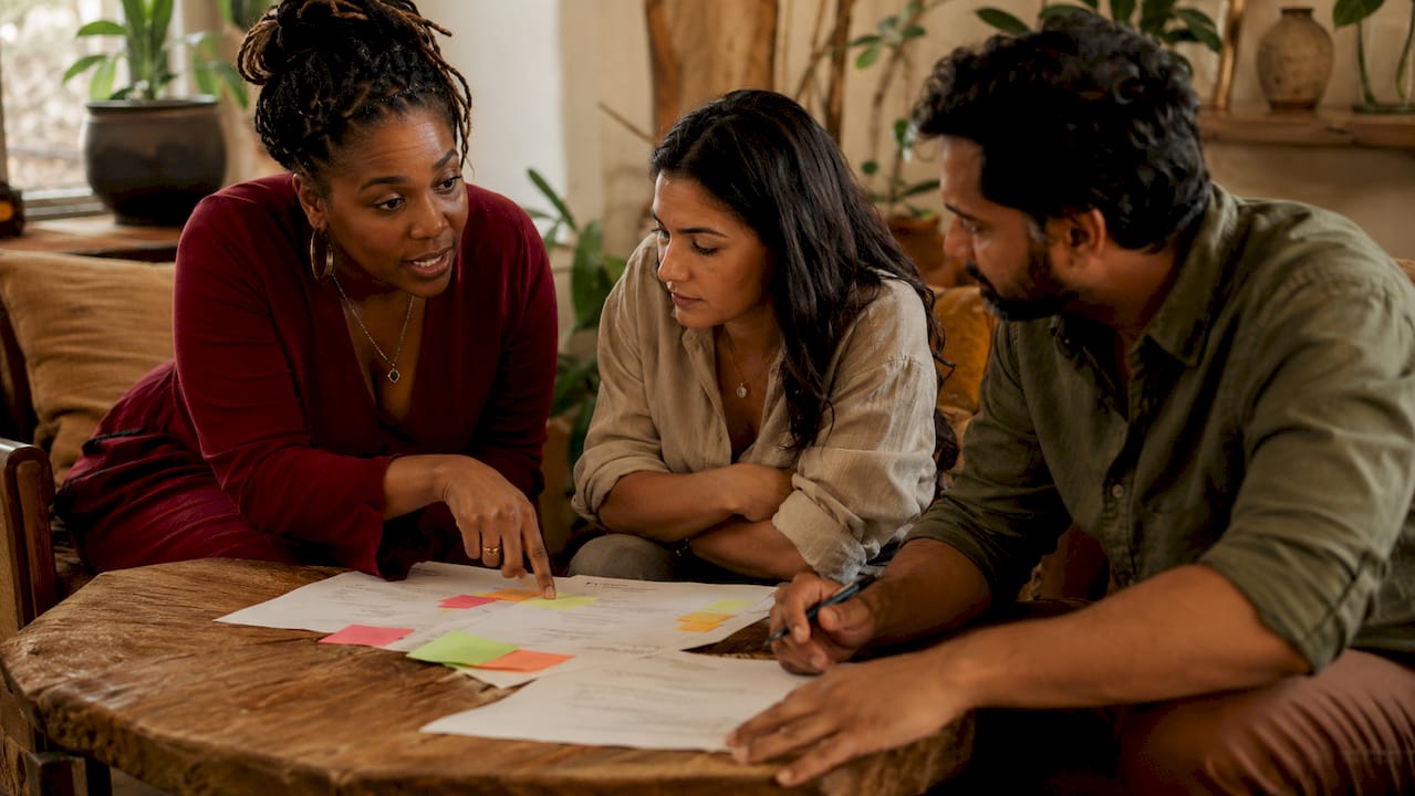 Business team discussing decision filters in meeting