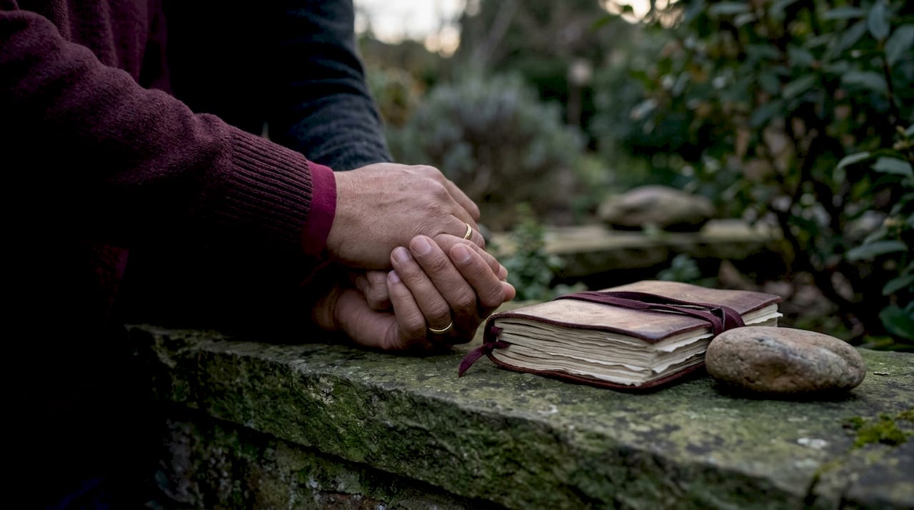 Close-up of couple hands holding during prayer