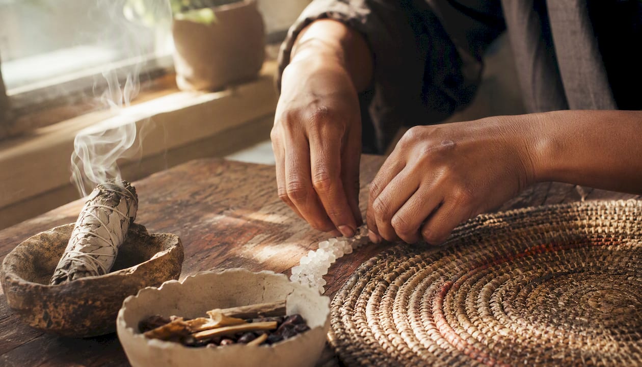 Hands sprinkling salt for ritual cleansing