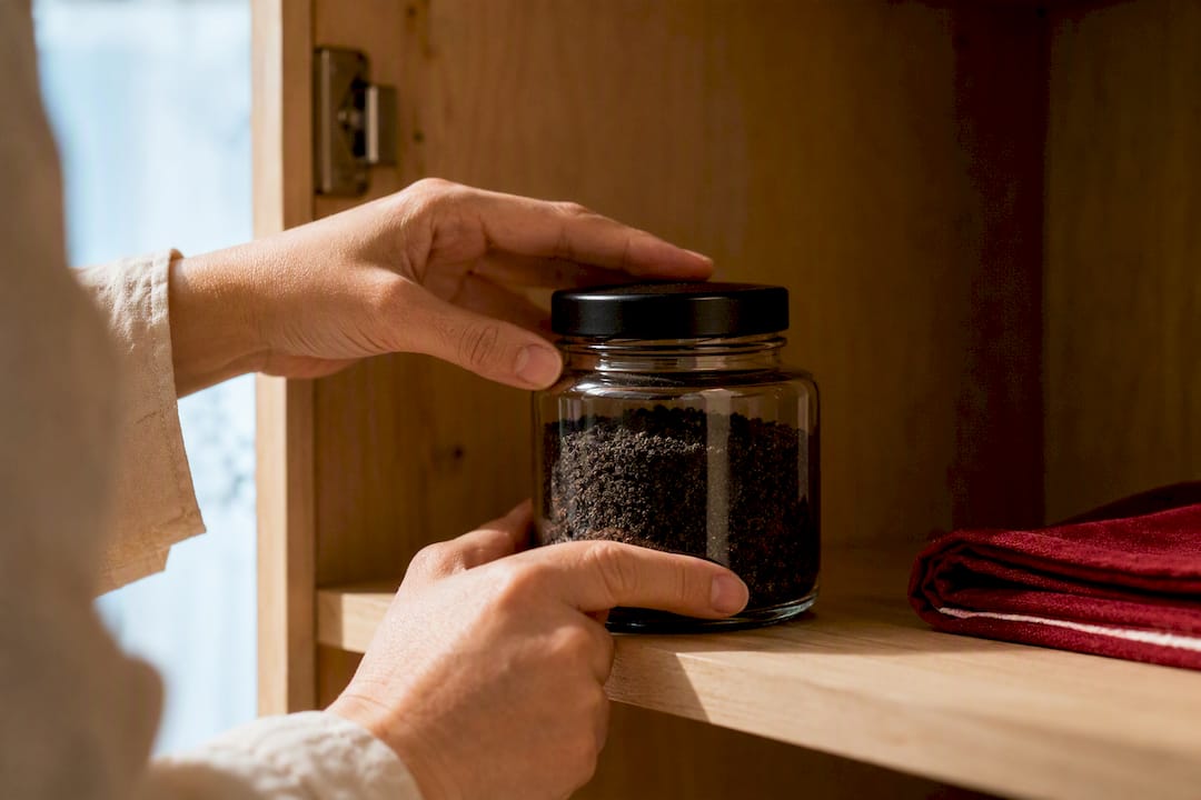 Sealed jar of black salt in cupboard