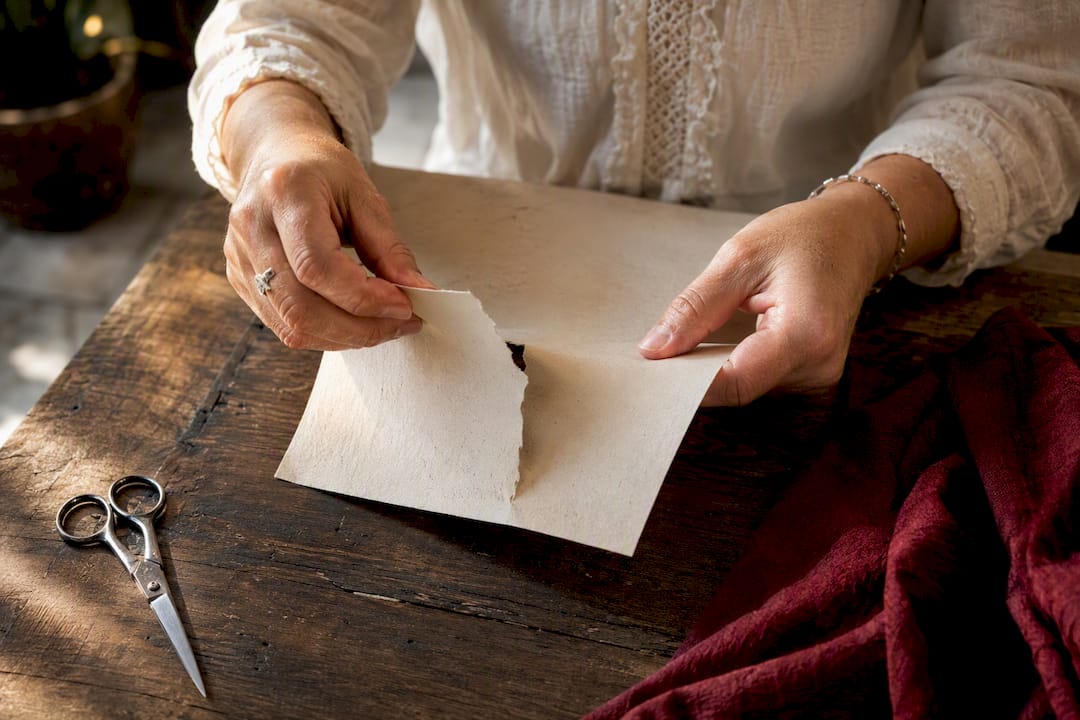 Hands tearing a petition paper