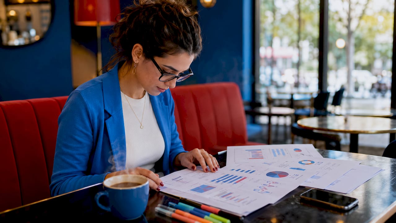 Social media manager studying Instagram analytics report