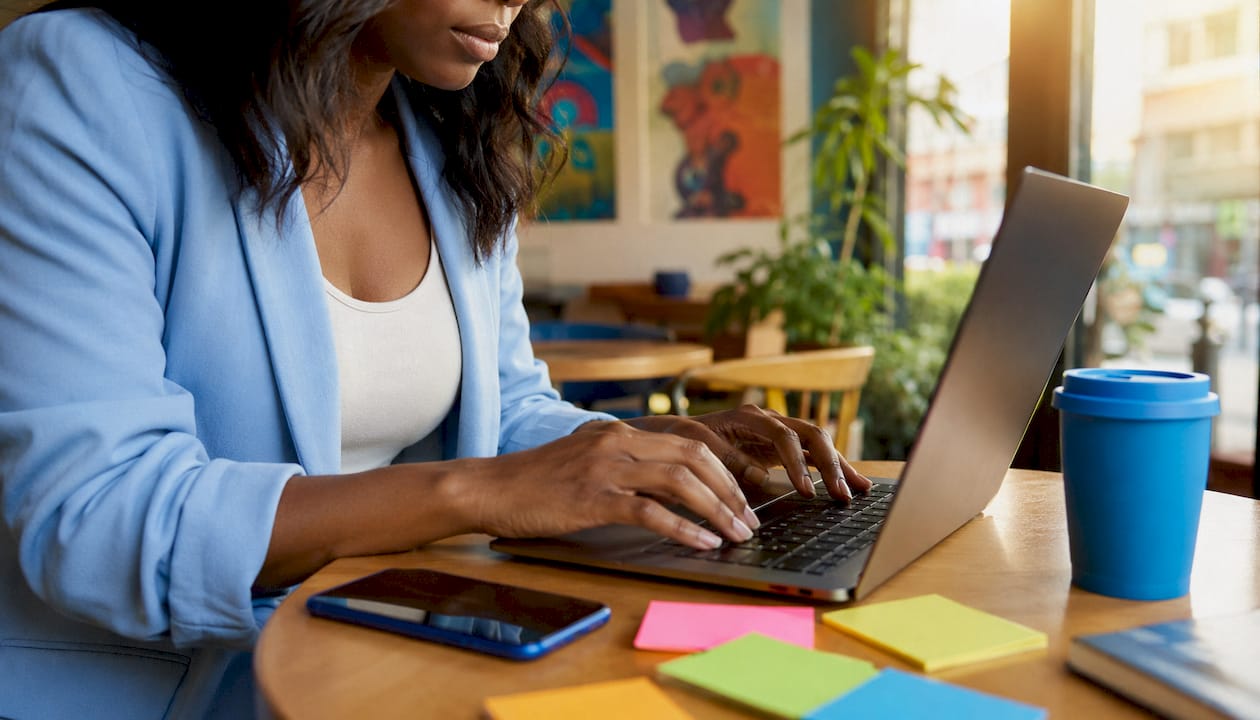 Person managing social media growth at home desk