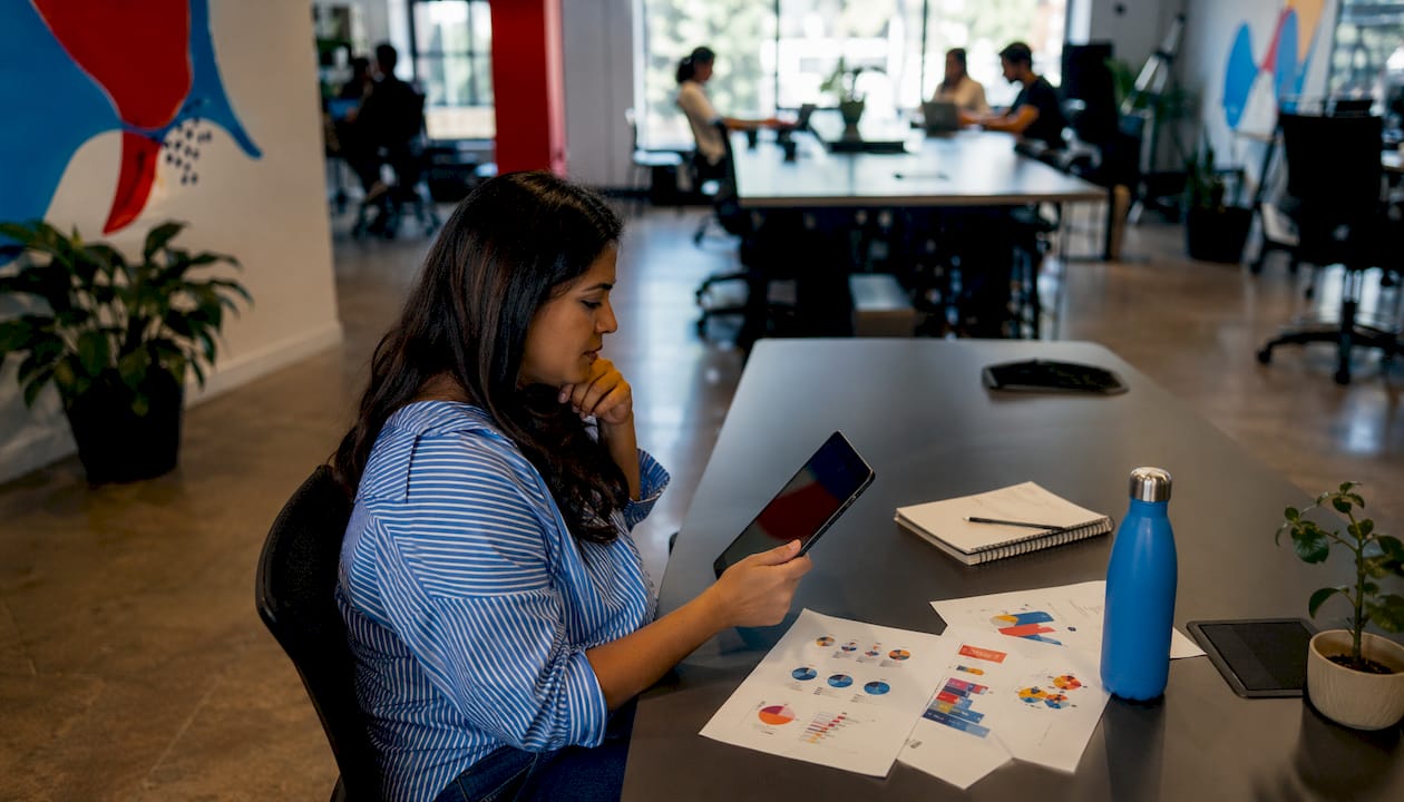 Woman analyzing social media metrics at desk