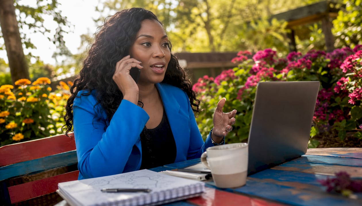 Woman managing influencer partnerships in café