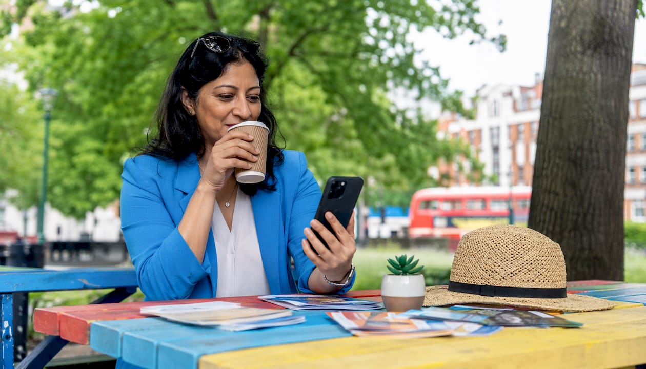 UK small business owner managing social media on devices