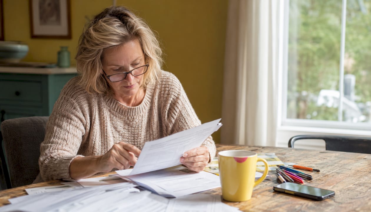 Homeowner reviewing home improvement warranty documents