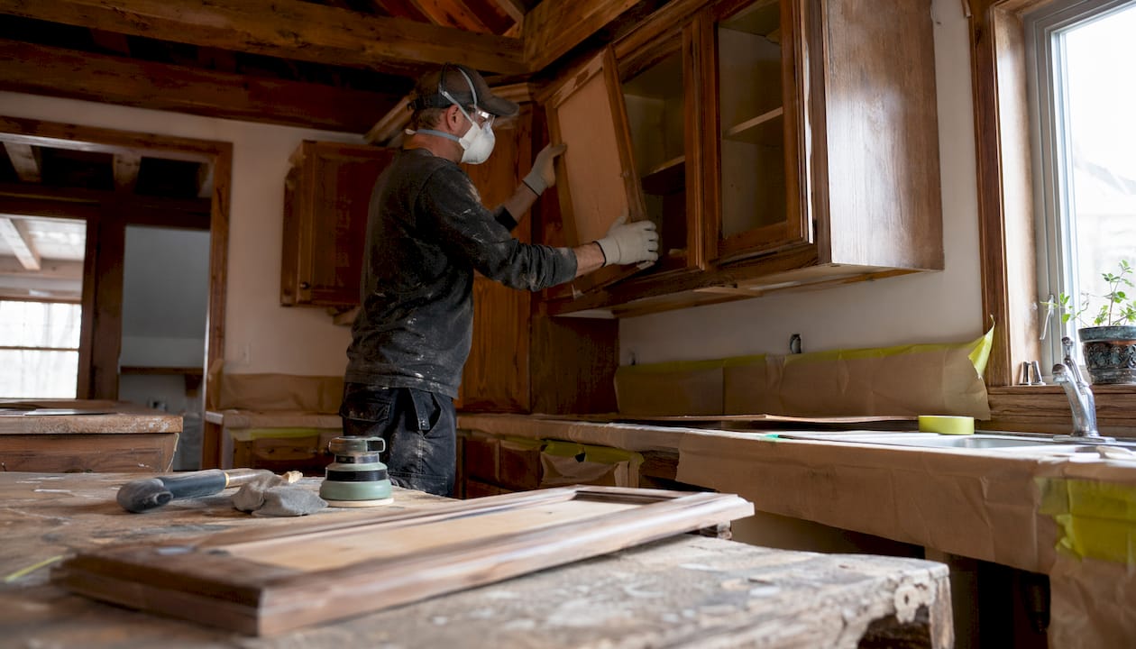 Contractor prepping and labeling kitchen cabinet doors