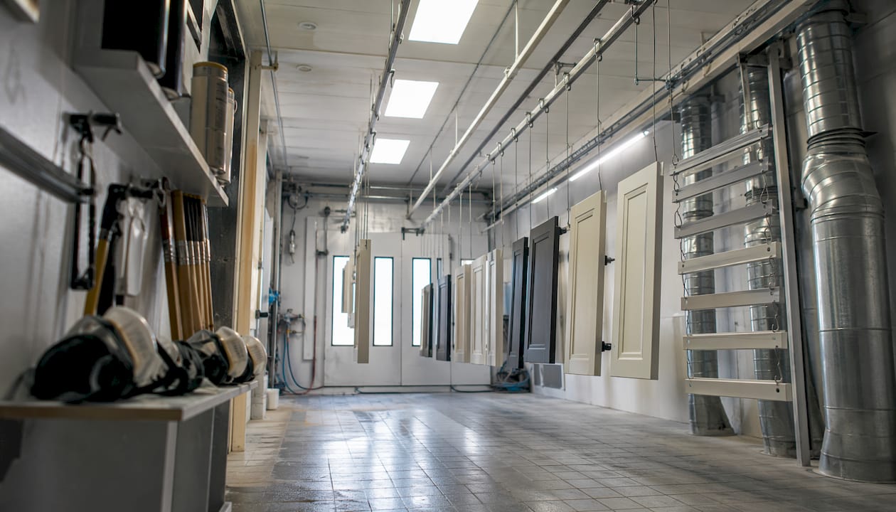 Side-draft spray booth interior with cabinets hanging