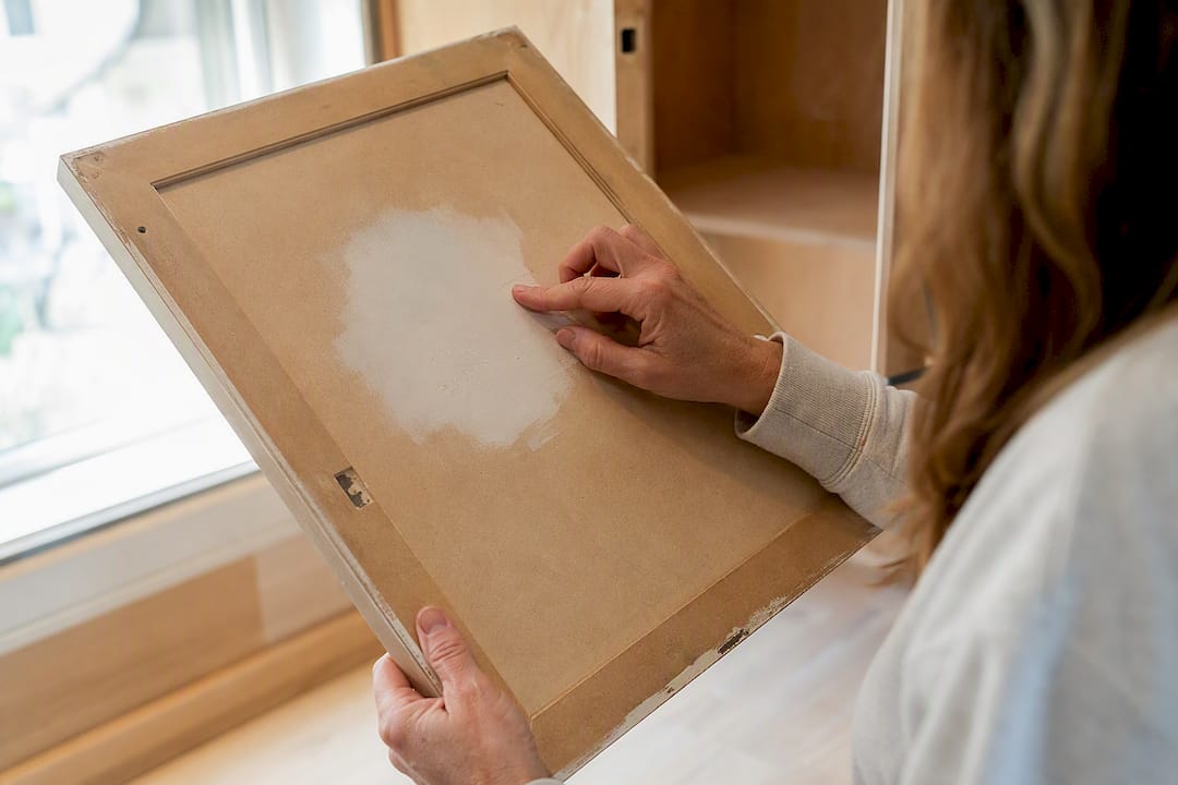Testing paint adhesion on cabinet door patch