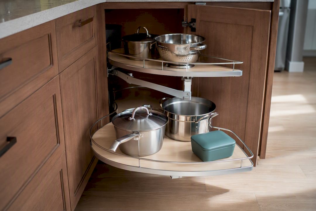 Swing-out shelf reclaiming corner cabinet storage