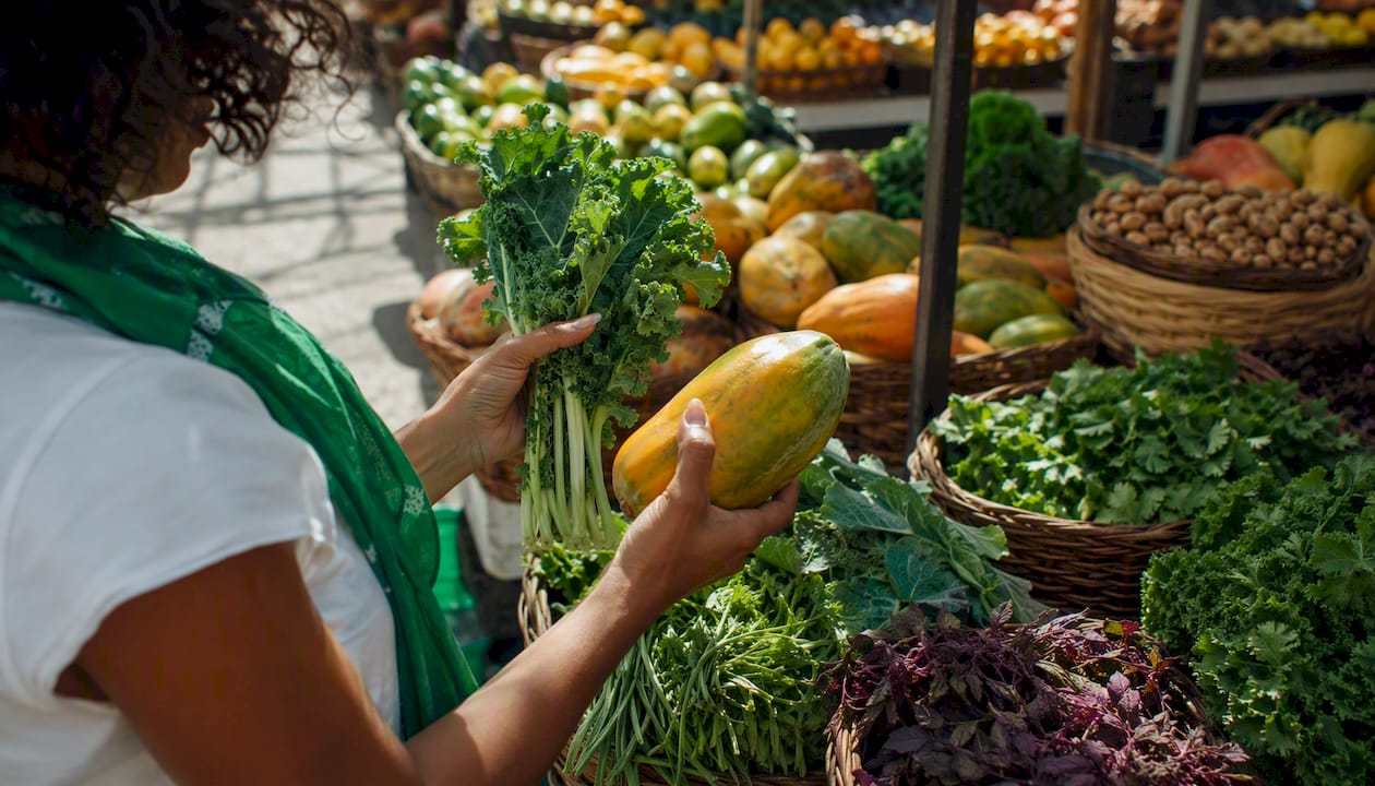 Hands selecting fresh alkaline fruits and herbs