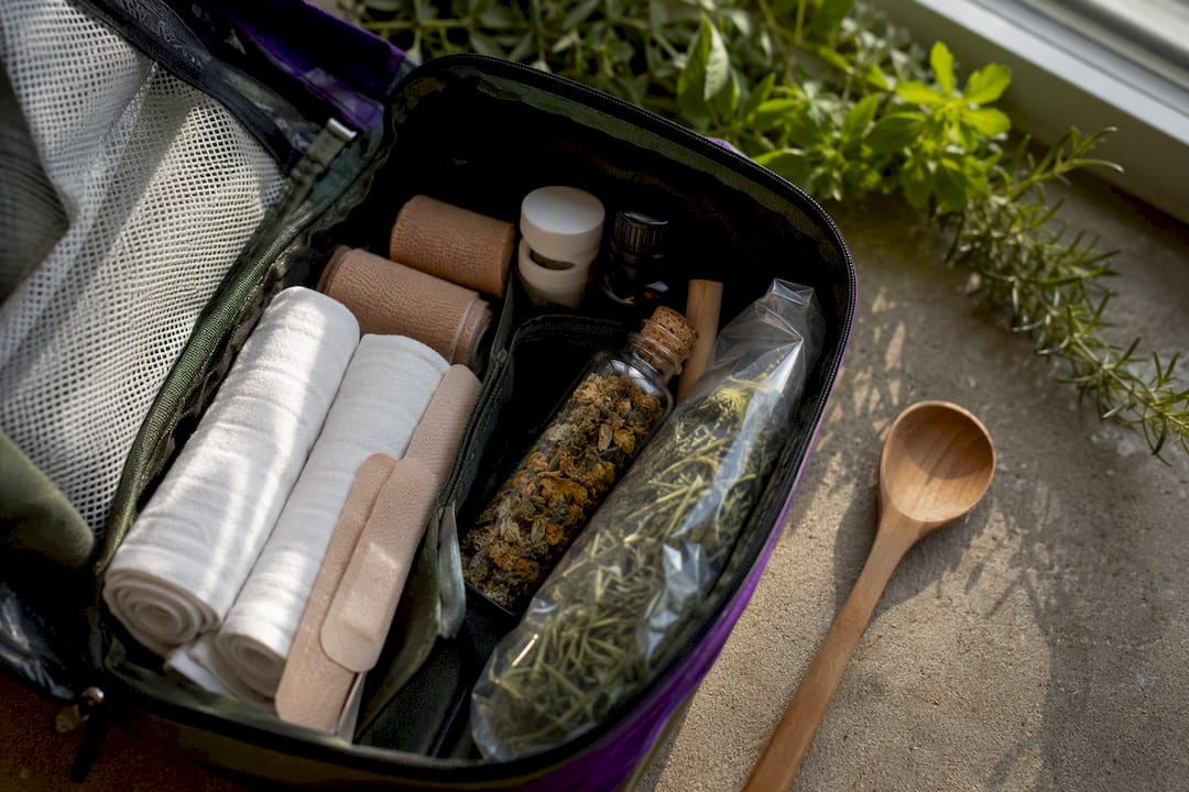 Emergency medical kit beside herbal jar